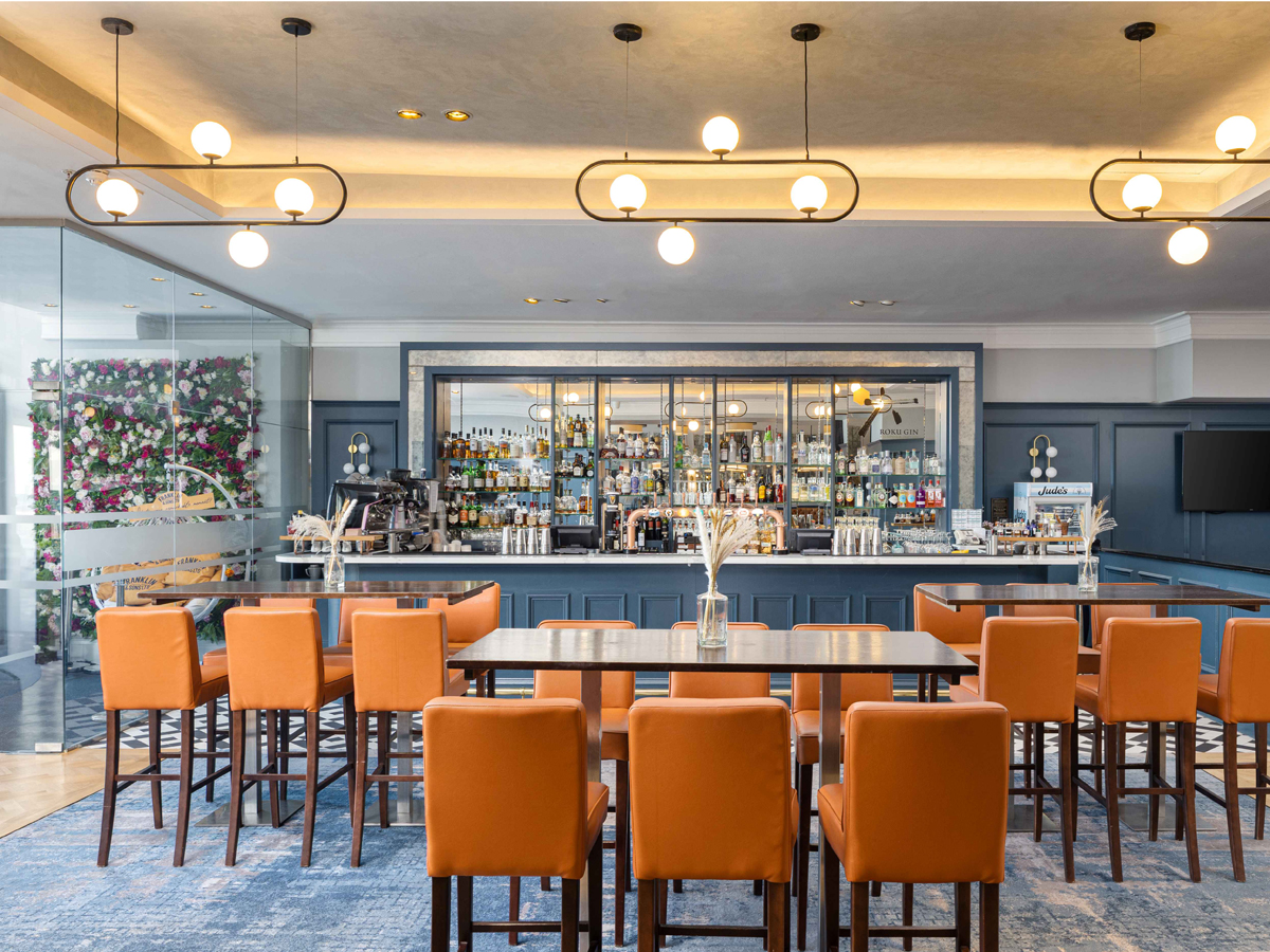 DoubleTree by Hilton Brighton Metropole promo image for The Great Dragon Count. The photo shows the bar & terrace area.