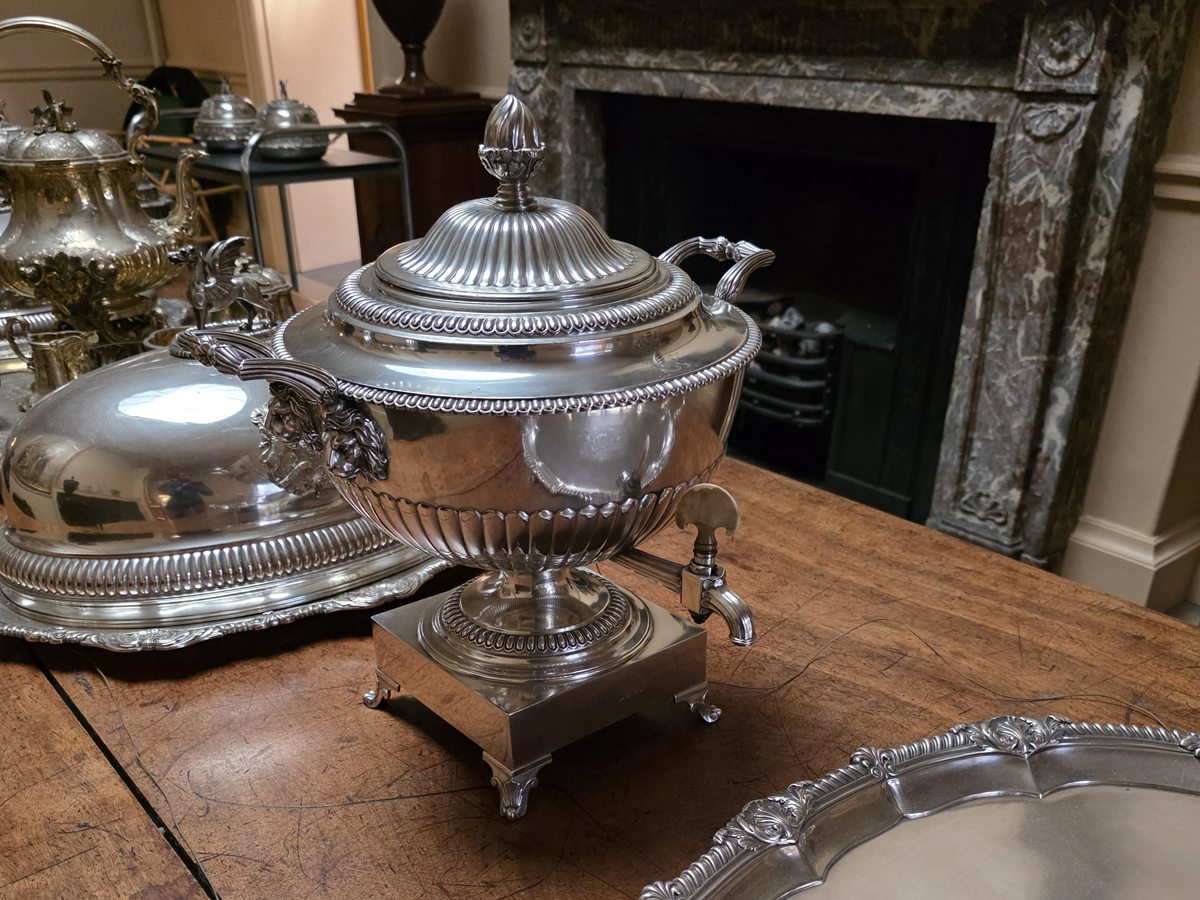 The completed water urn reintroduced to the table
