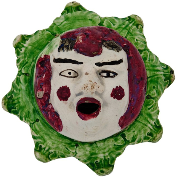Ceramic inkwell featuring a clown’s face, 1800s